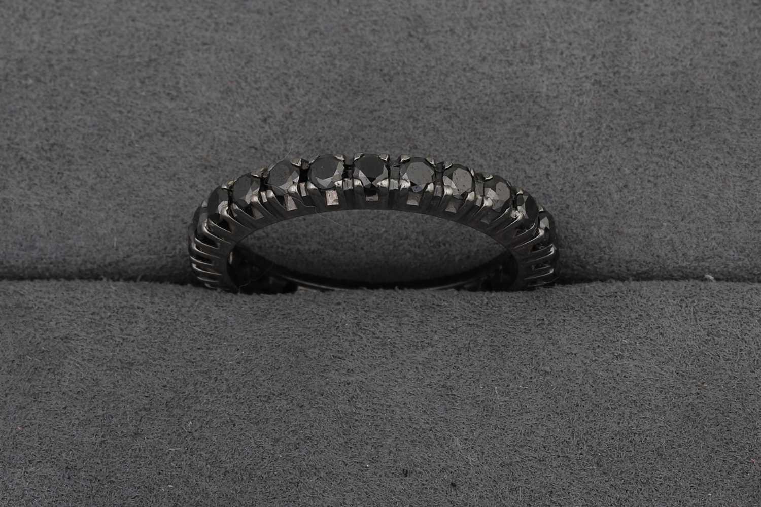 A BLACK DIAMOND FULL BANDED ETERNITY RING,...
