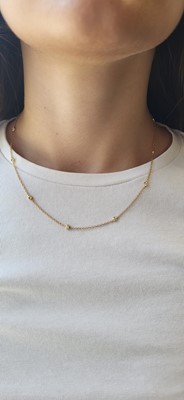 A DIAMOND SET CHAIN NECKLACE, the collet set...