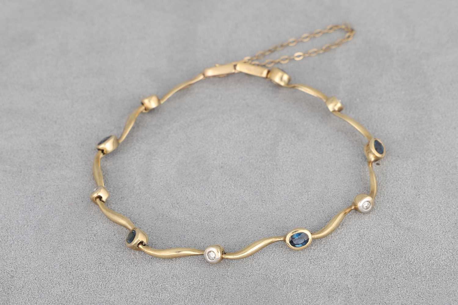 Lot 27 - A SAPPHIRE AND DIAMOND SET BRACELET, mounted...