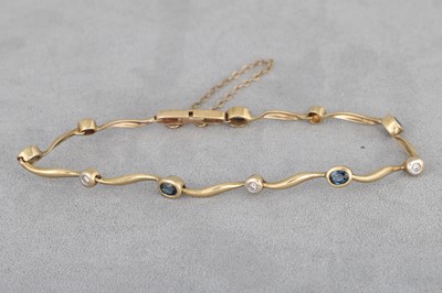 Lot 27 - A SAPPHIRE AND DIAMOND SET BRACELET, mounted...