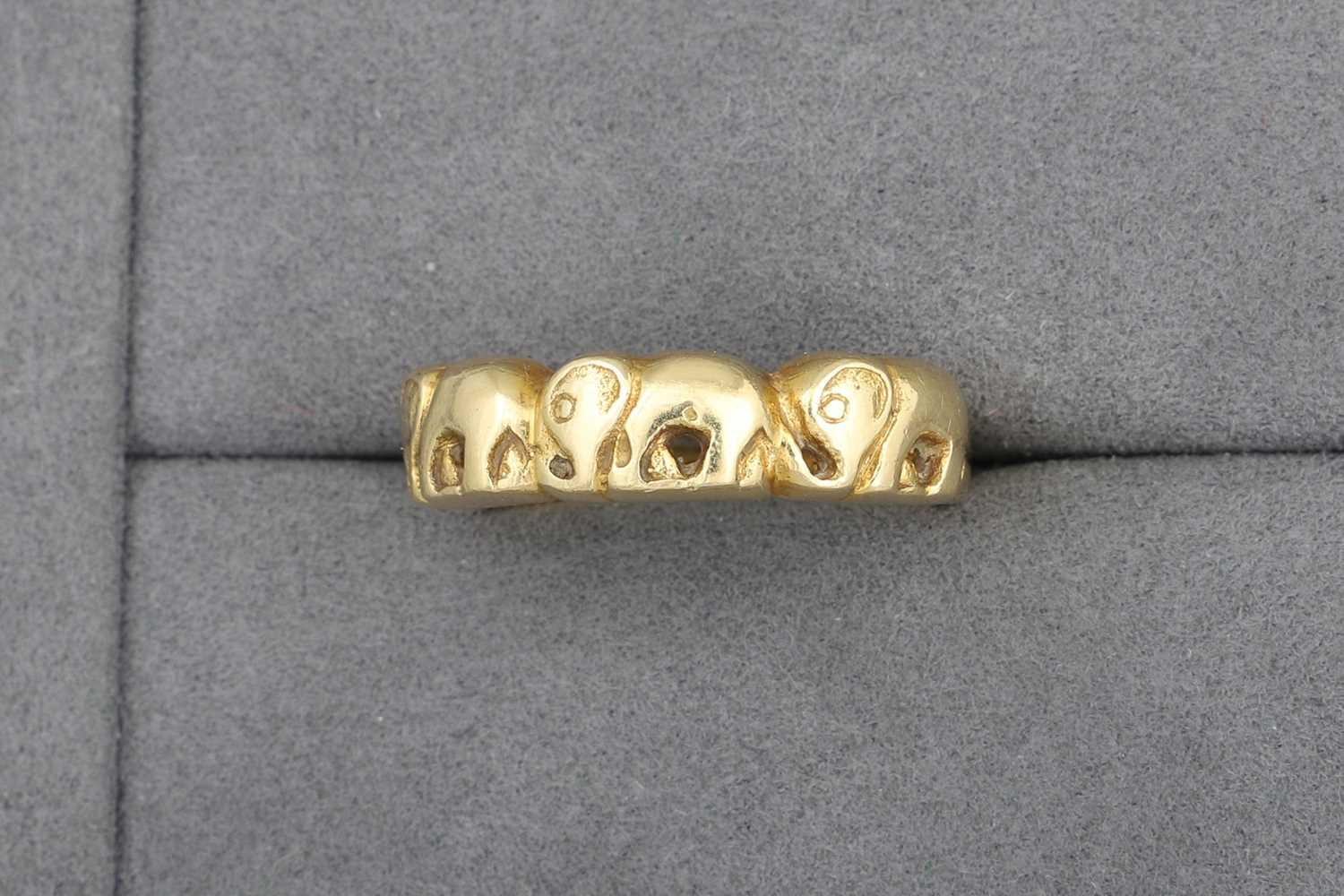Lot 30 - AN 18CT GOLD BAND RING, with elephant motifs,...