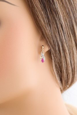 Lot 55 - A PAIR OF RUBY EARRINGS, pear shaped, set with...