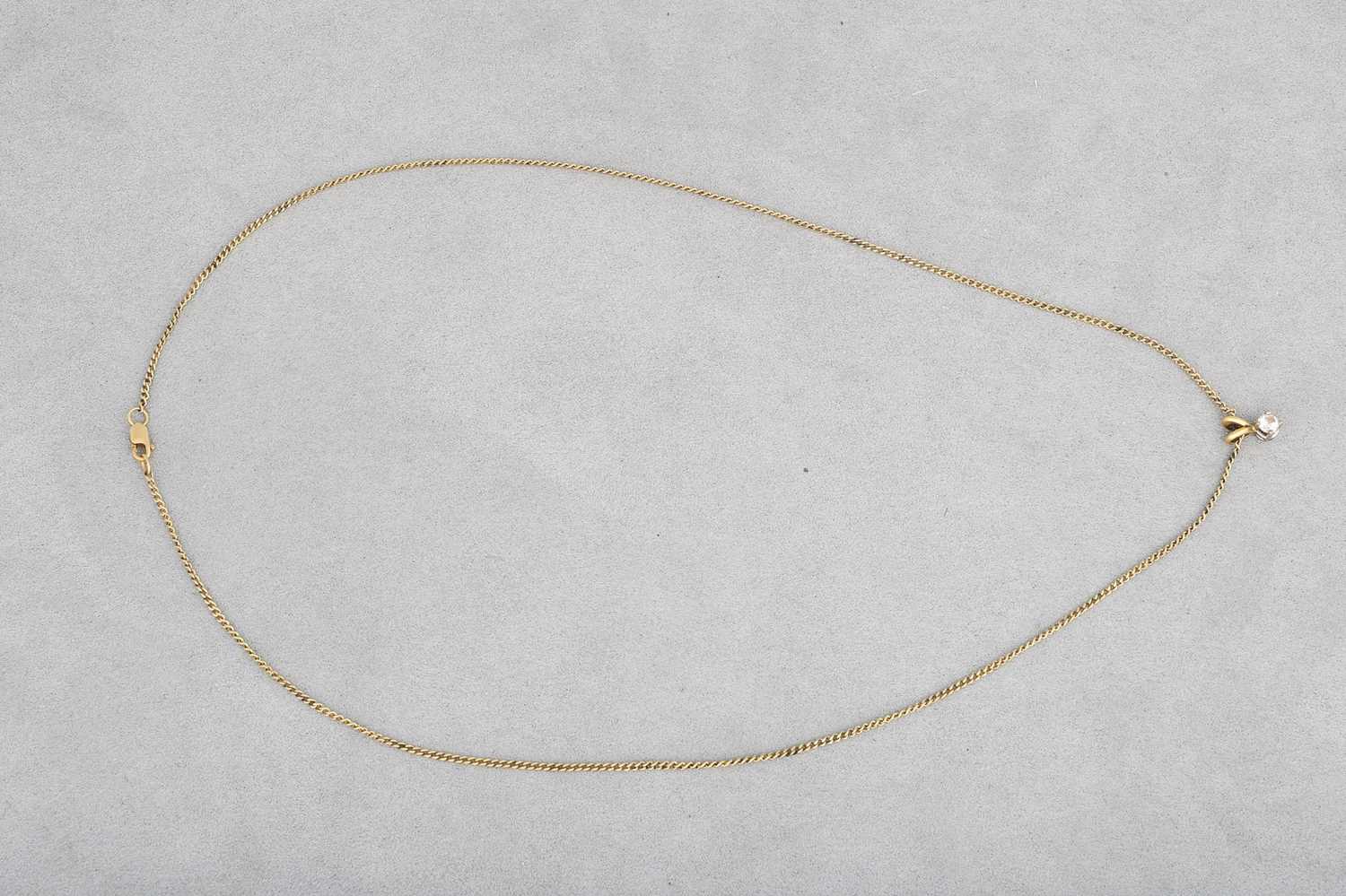 Lot 33 - A DIAMOND PENDANT, mounted in 18ct gold on an...