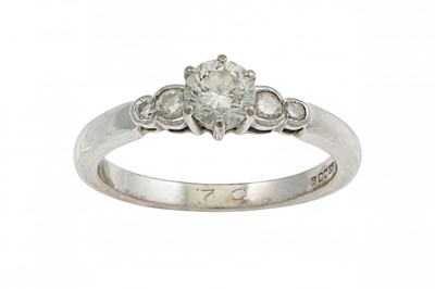 Lot 228 - A DIAMOND SOLITAIRE RING, diamond shoulders...