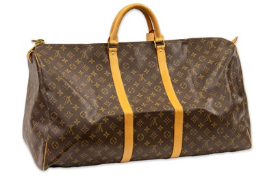 Lot 416 - A LOUIS VUITTON "KEEP ALL TRAVEL BAG" coated...