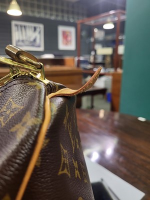 Lot 416 - A LOUIS VUITTON "KEEP ALL TRAVEL BAG" coated...