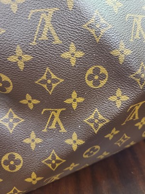 Lot 416 - A LOUIS VUITTON "KEEP ALL TRAVEL BAG" coated...