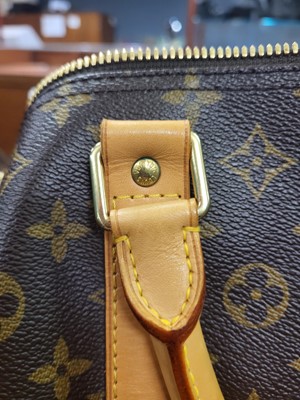 Lot 416 - A LOUIS VUITTON "KEEP ALL TRAVEL BAG" coated...