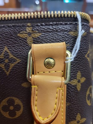 Lot 416 - A LOUIS VUITTON "KEEP ALL TRAVEL BAG" coated...