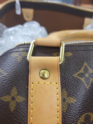 Lot 416 - A LOUIS VUITTON "KEEP ALL TRAVEL BAG" coated...