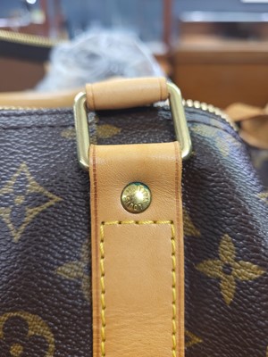Lot 416 - A LOUIS VUITTON "KEEP ALL TRAVEL BAG" coated...