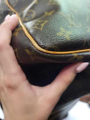 Lot 417 - A LOUIS VUITTON "KEEP ALL TRAVEL BAG" coated...