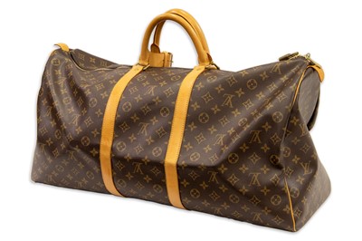 Lot 417 - A LOUIS VUITTON "KEEP ALL TRAVEL BAG" coated...