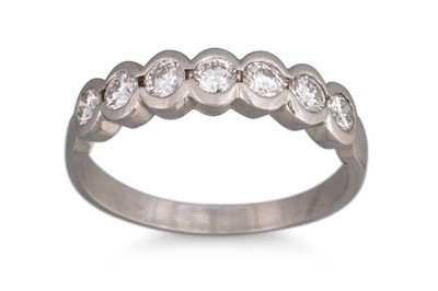 Lot 325 - A SEVEN STONE DIAMOND RING, mounted in 18ct...