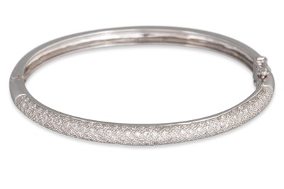 Lot 361 - A DIAMOND SET BANGLE, pavé set in 18ct white...