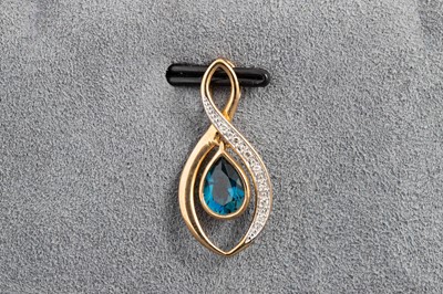 Lot 153 - A TOPAZ SET 'INFINITY' PENDANT, mounted in 9ct...