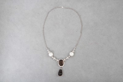 Lot 160 - A SMOKY QUARTZ, DIAMOND AND BUTTON PEARL...