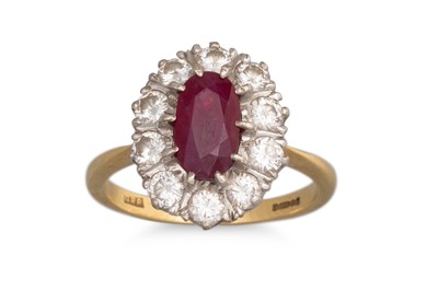 Lot 316 - A RUBY AND DIAMOND CLUSTER RING, the oval ruby...
