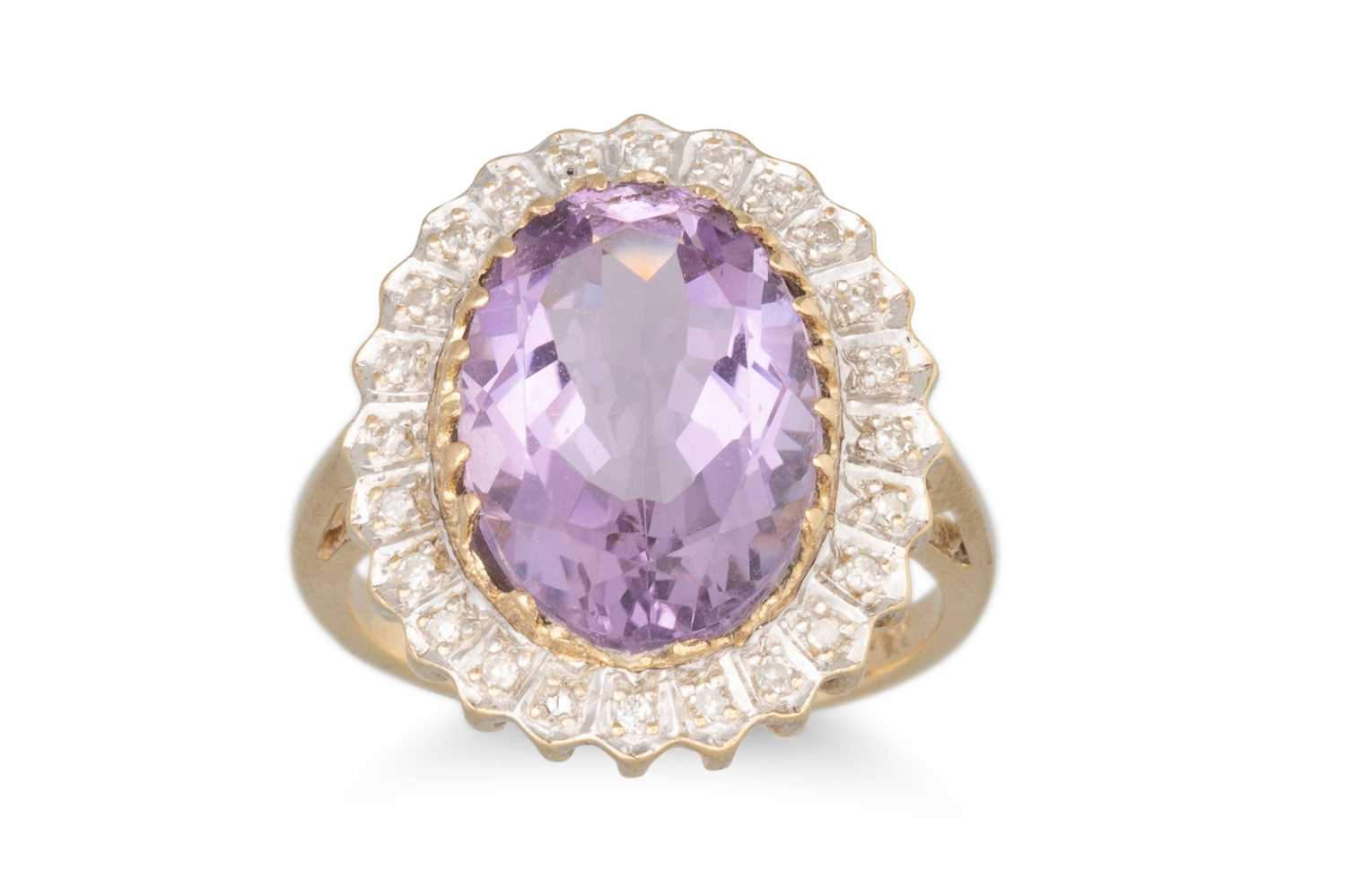 Lot 15 - AN AMETHYST AND DIAMOND CLUSTER RING, mounted...
