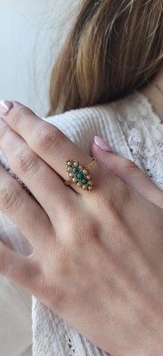 Lot 34 - A TURQUOISE AND SEED PEARL RING, navette style...