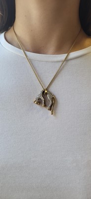 Lot 38 - A 9CT GOLD STONE SET PENDANT, modelled as a...