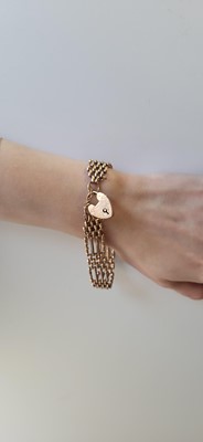 Lot 57 - A 9CT GOLD GATE BRACELET, with padlock clasp,...