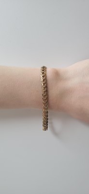 Lot 67 - A 9CT GOLD FANCY FLAT LINK BRACELET, 7.2" long,...