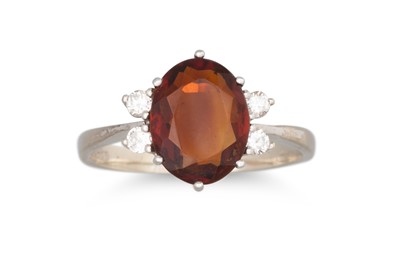 Lot 69 - A DIAMOND AND QUARTZ CLUSTER RING, the oval...