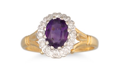 Lot 107 - A DIAMOND AND AMETHYST CLUSTER RING, the oval...