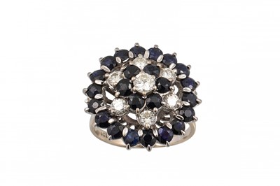 Lot 338 - A SAPPHIRE AND DIAMOND CLUSTER DRESS RING, set...