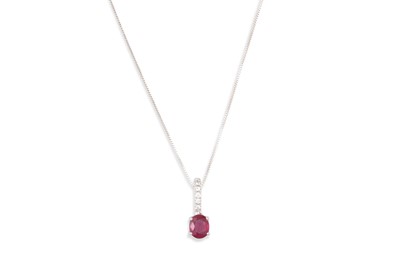 Lot 251 - A RUBY AND DIAMOND PENDANT, the oval ruby to...