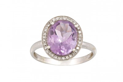 Lot 155 - AN AMETHYST AND DIAMOND CLUSTER RING, mounted...