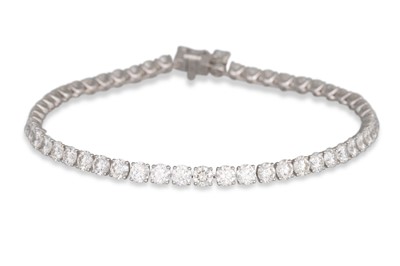Lot 357 - A DIAMOND LINE BRACELET, the brilliant cut...