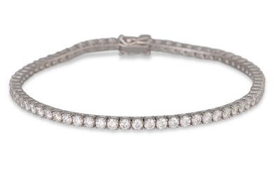 Lot 158 - A DIAMOND LINE BRACELET, the brilliant cut...