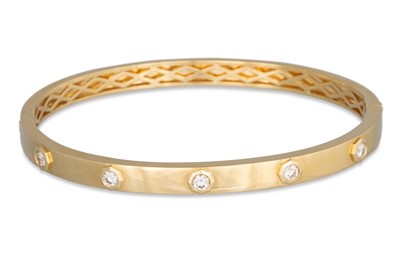 Lot 174 - A DIAMOND SET BANGLE, the diamonds inset to an...