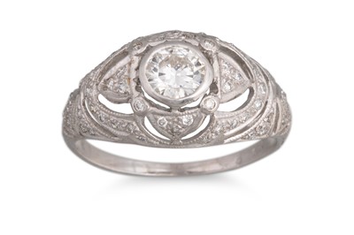 Lot 406 - A DIAMOND RING, of bombé form, the centre...