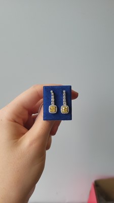 Lot 409 - A PAIR OF DIAMOND DROP EARRINGS, comprising...