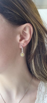 Lot 409 - A PAIR OF DIAMOND DROP EARRINGS, comprising...
