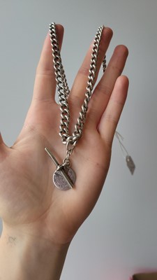 Lot 93 - AN ANTIQUE SILVER ALBERT NECKLACE, suspending...