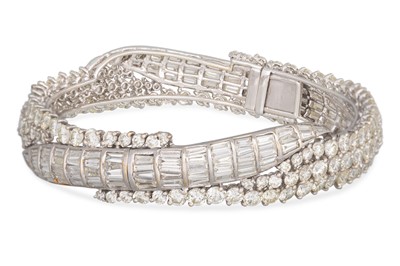 Lot 386 - A DIAMOND SET HINGED BRACELET, set with...