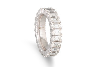 Lot 270 - AN EMERALD CUT DIAMOND ETERNITY RING, mounted...
