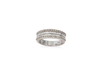 Lot 127 - A DIAMOND FOUR ROWED RING, set with baguette...