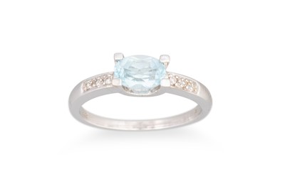 Lot 75 - A TOPAZ RING, to diamond shoulders, mounted in...