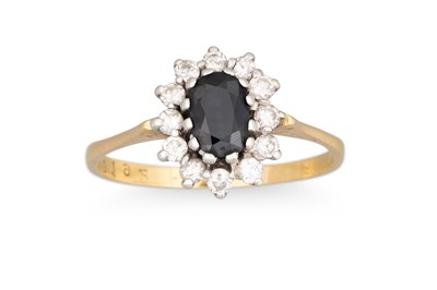 Lot 77 - A SAPPHIRE AND DIAMOND CLUSTER RING, the oval...