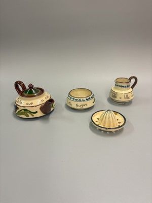 Lot 476 - TORQUAY MOTTO POTTERY, to include a teapot,...