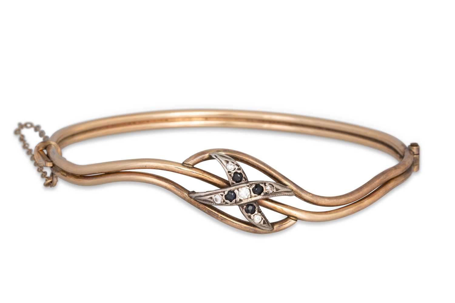 Lot 58 - A 1/10 9CT GOLD PLATED STONE SET BANGLE, (10 g....