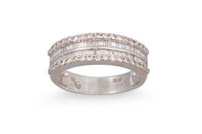 Lot 221 - A DIAMOND TRIPLE ROW RING, the baguette cut...