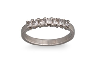 Lot 244 - A DIAMOND SEVEN STONE RING, the princess cut...