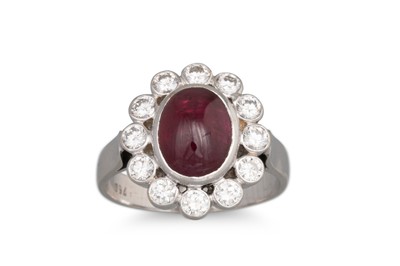 Lot 145 - A DIAMOND AND SPINEL CABOCHON RING, mounted in...