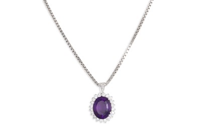 Lot 147 - AN AMETHYST AND DIAMOND CLUSTER PENDANT,...